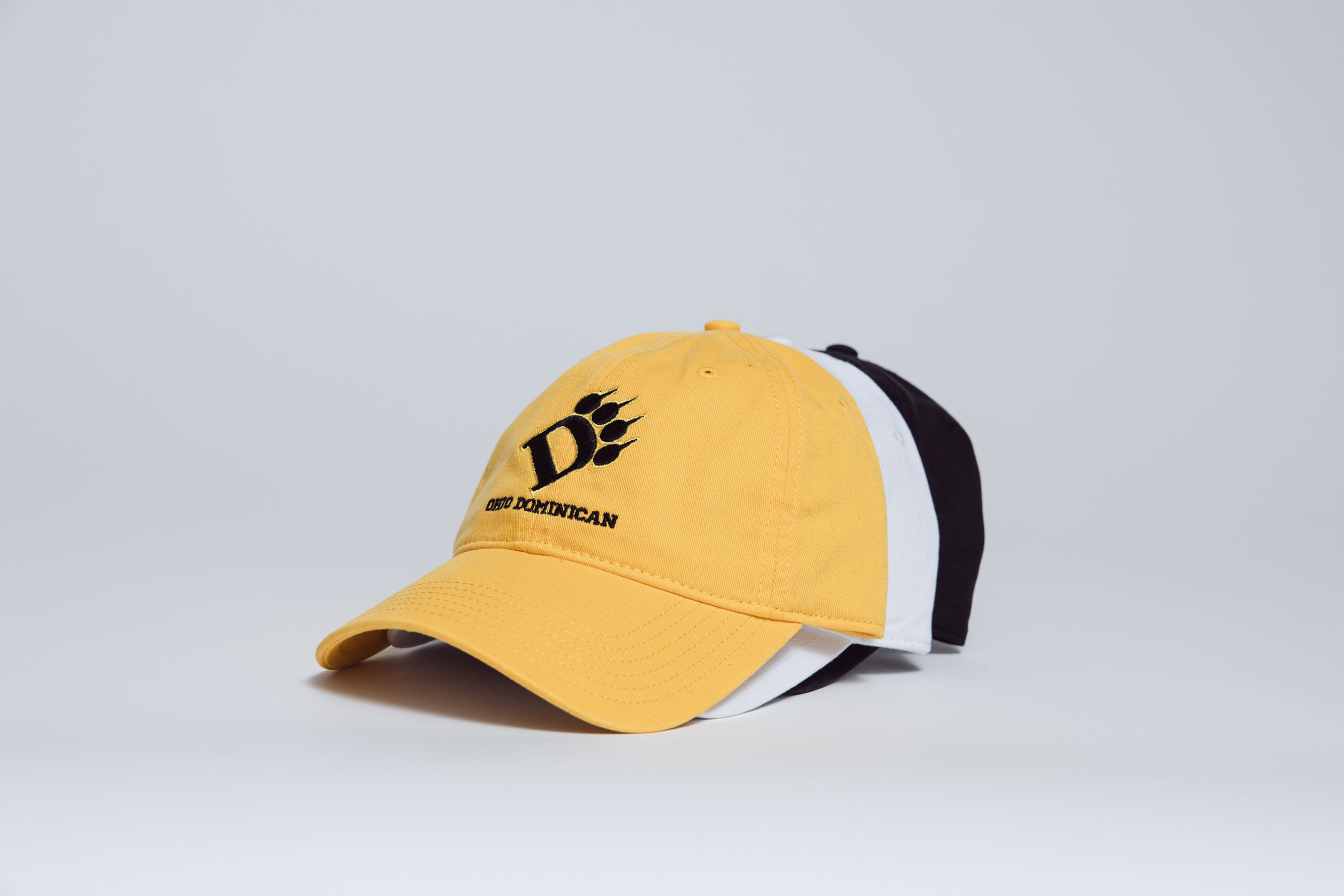 Yellow cap with a black logo on a light gray background