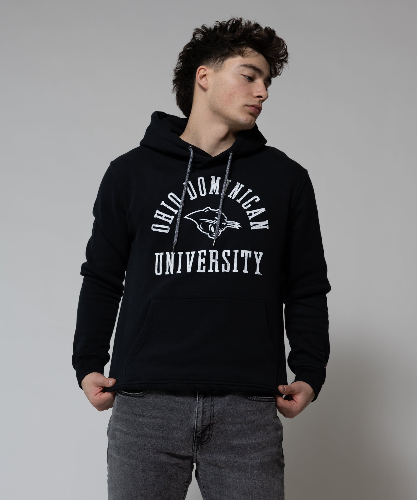 Person wearing a black hoodie with 'Old Dominion University' text on a plain background