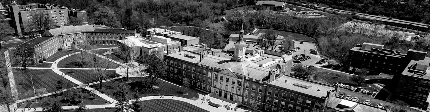 Black and white image of a campus with buildings and pathways